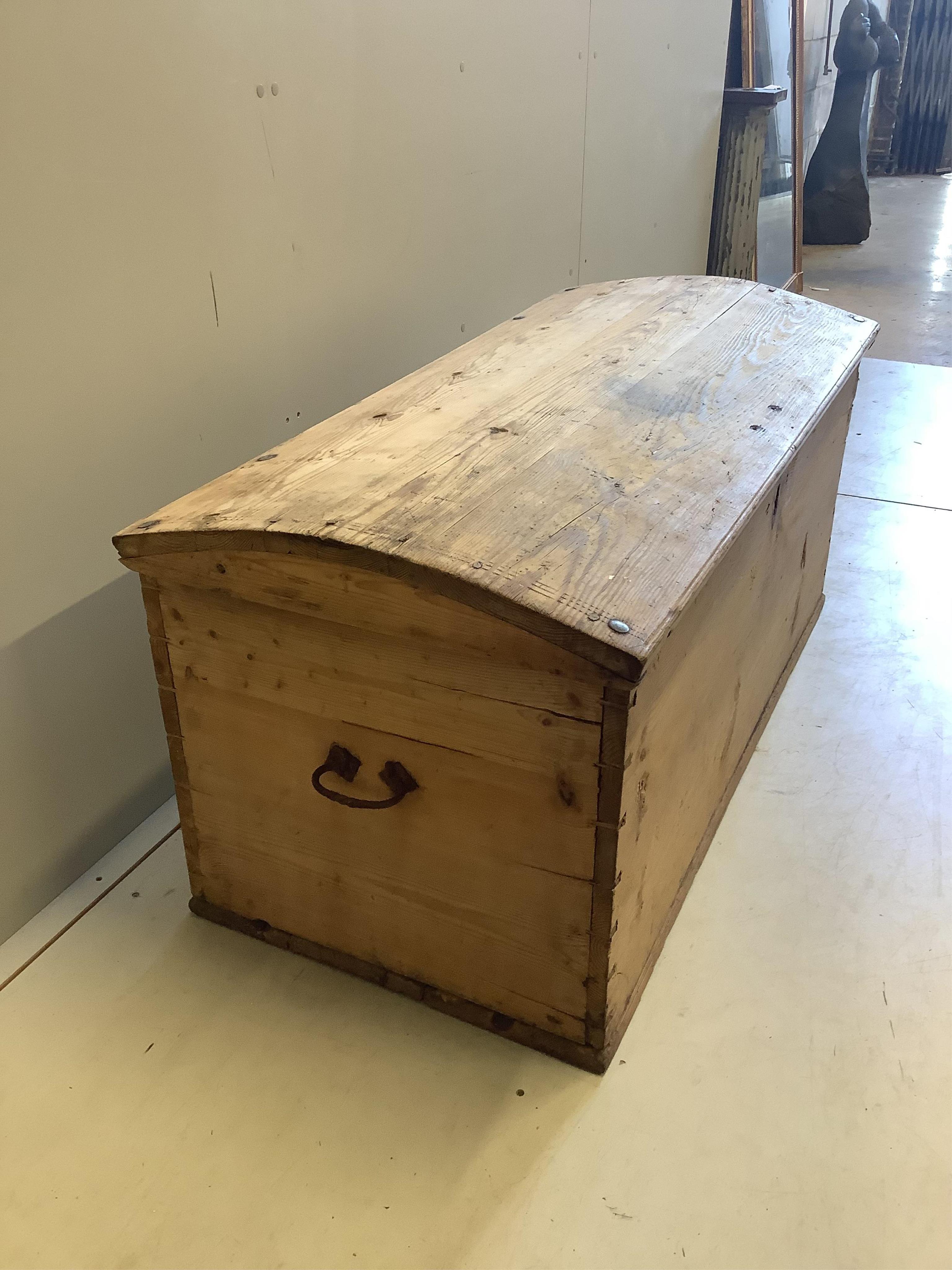 A 19th century Continental pine domed top trunk, width 127cm, depth 58cm, height 57cm. Condition - fair